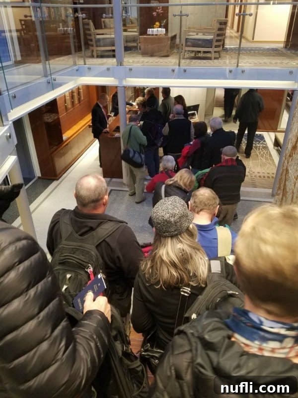People lined up, excitedly boarding the Viking Vili river cruise ship, ready for their journey.