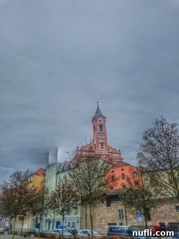 A grand church in Passau with striking pink-painted architectural details.