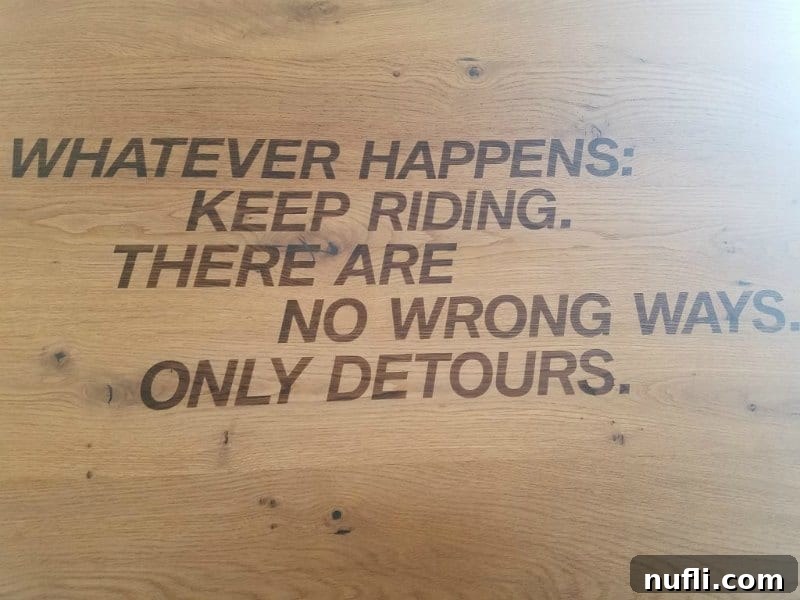 Germany: Where I Found What My Life Was Missing 9 Inspirational sign in a BMW showroom: 'Whatever happens, keep riding. There are no wrong ways, only detours.'