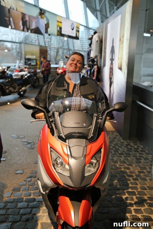 Munich Unveiled: A Viking River Cruise Adventure 3 Tammilee sitting on a BMW bike