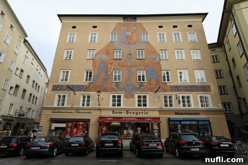 buildings with a gorgeous painting and cars parked in front