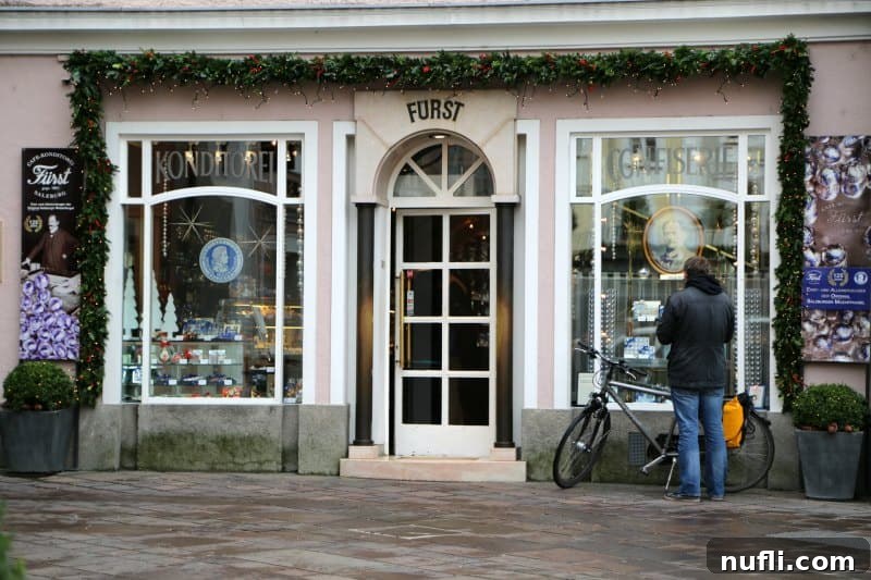 Furst sign over a glass door with person standing by a bike