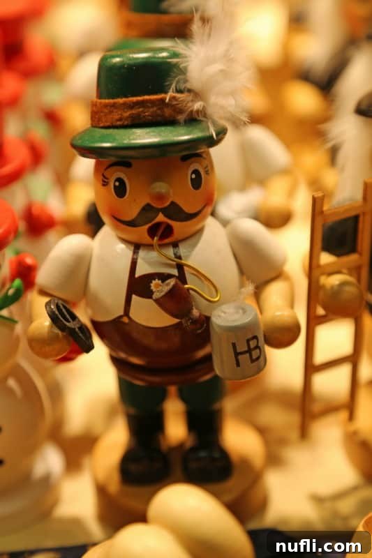 Charming German nutcracker holding a pretzel and a beer mug