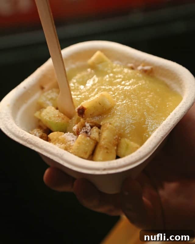 Delicious applesauce coated dish with a spoon inside