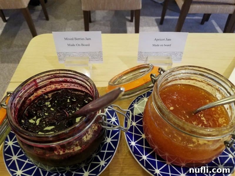 jam in glass bowls on blue plates