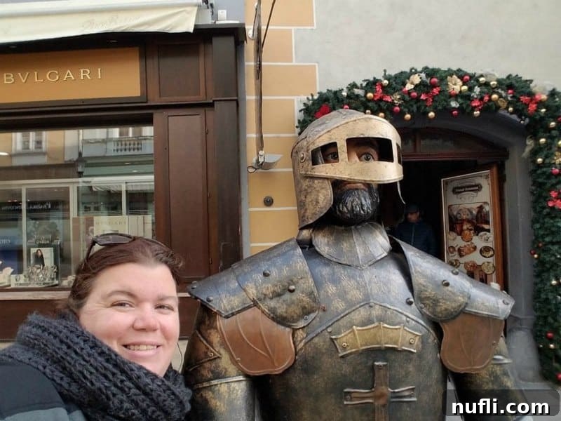 Tammilee posing next to a decorative knight figure in Bratislava