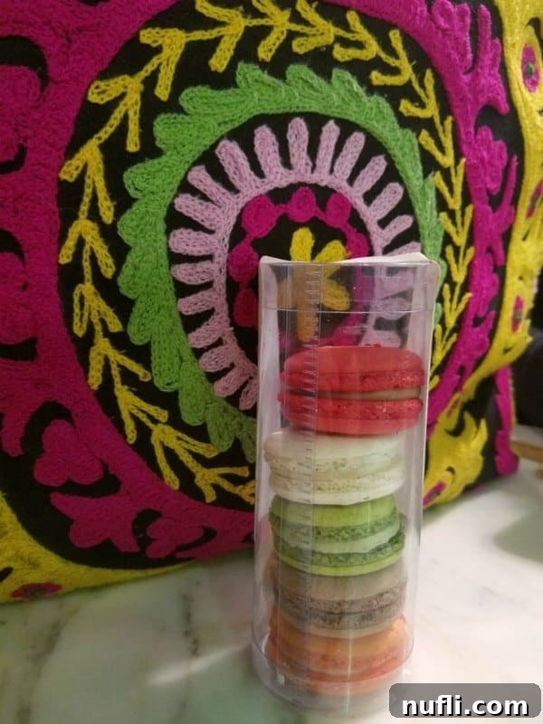 colorful bag next to a stack of macarons 