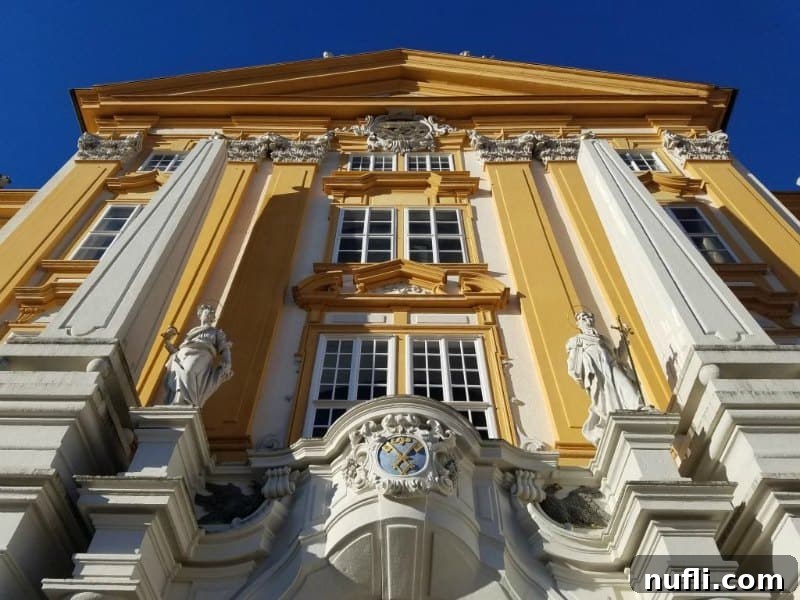 Majestic Melk Abbey, a prominent Baroque monastery with yellow and white facade