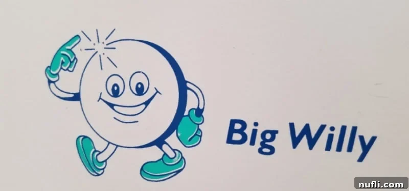 Humorous 'Big Willy' toilet paper dispenser sign inside Melk Abbey, a quirky travel moment