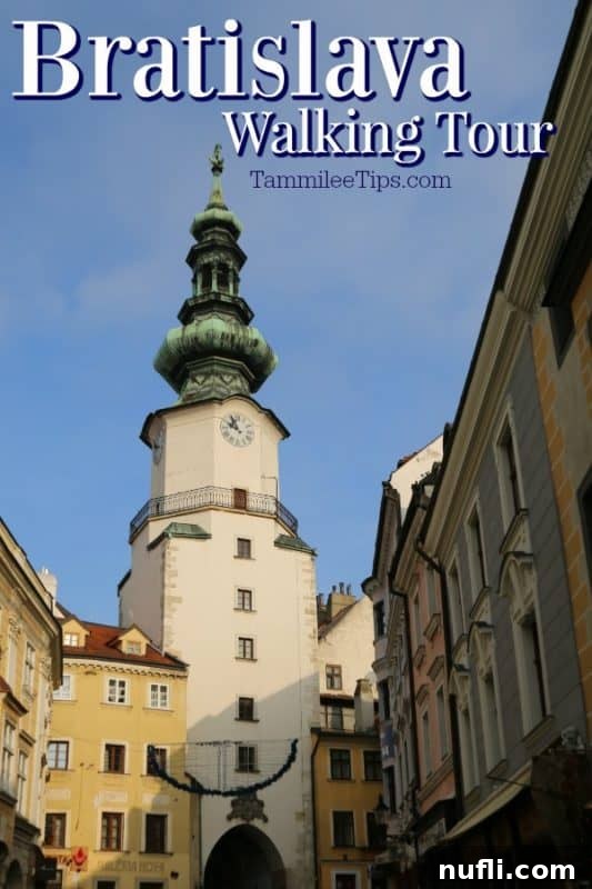 Bratislava Unveiled A Viking River Cruise Walking Experience 2 Panoramic view of historic buildings in Bratislava during a walking tour, showcasing the city's unique architecture under a clear sky.