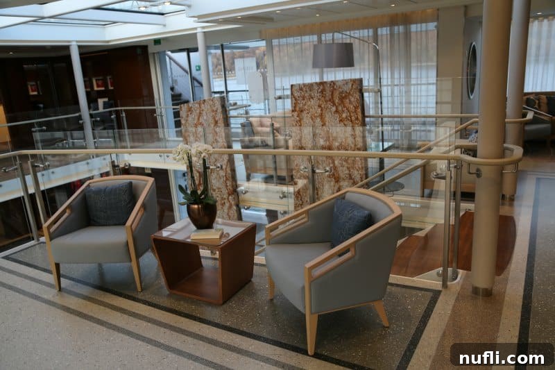 Discover the Viking Vili River Cruise Ship 14 sitting area near the stairs on the Viking Vili