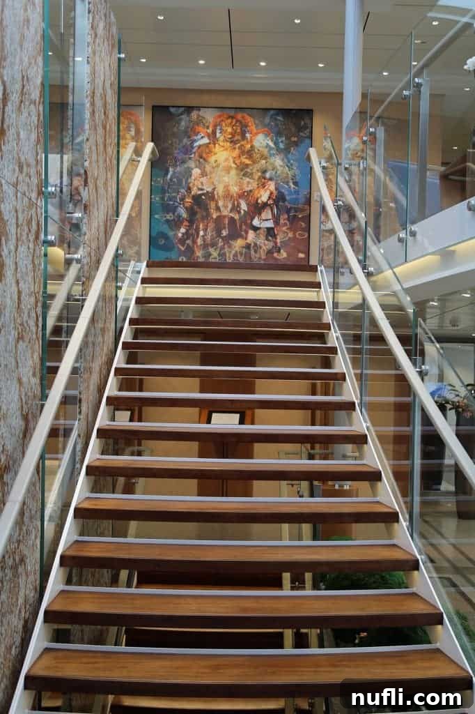 Discover the Viking Vili River Cruise Ship 18 stairs leading up to a large painting on the Viking Vili