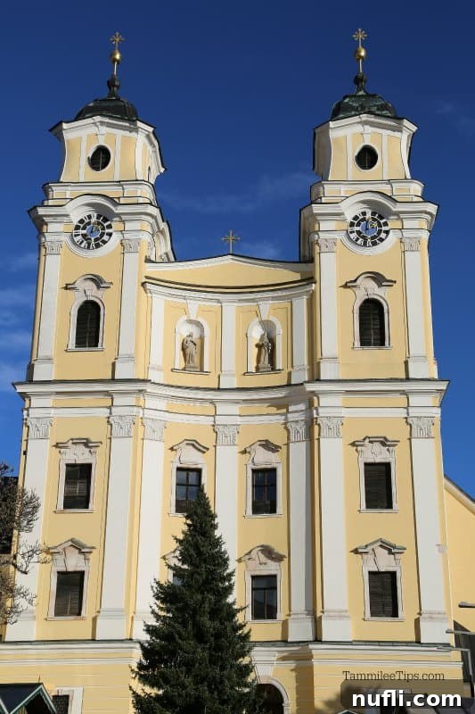Mondsee Cathedral yellow and white building 
