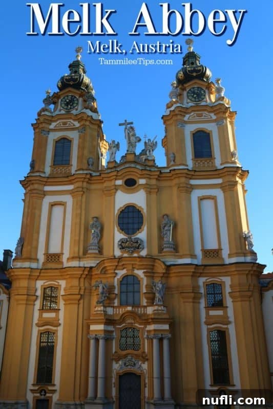 Melk Abbey's stunning Baroque facade glows yellow under the sun, a masterpiece of Austrian architecture overlooking the Danube.