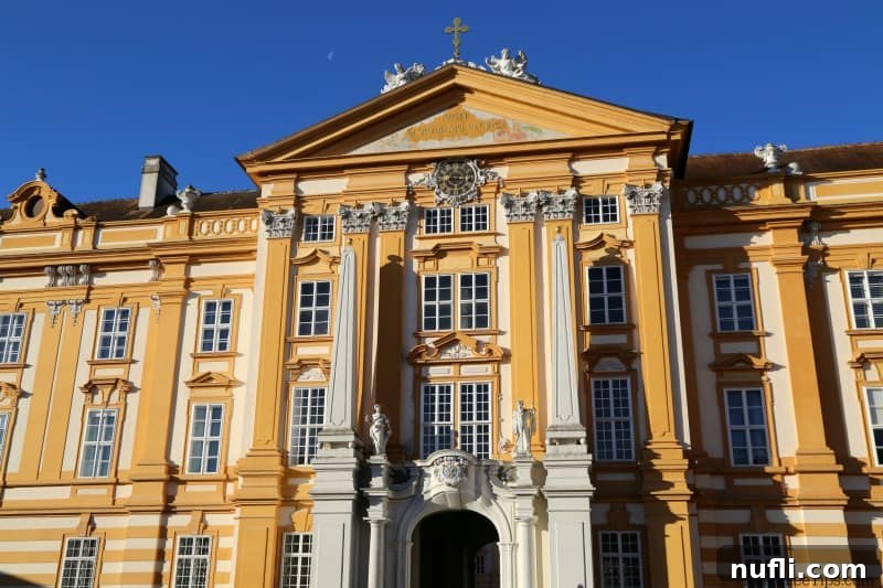 Melk Abbey Austria Baroque Masterpiece 4 A closer view of the intricately ornate front entrance of Melk Abbey, showcasing detailed craftsmanship.