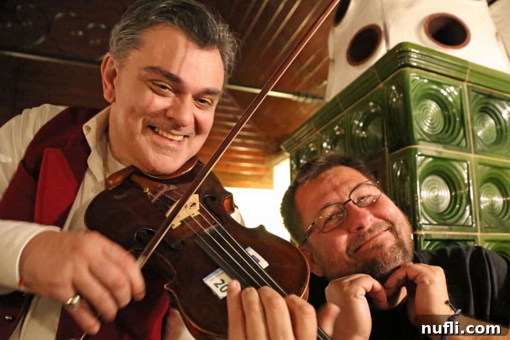 John and a guy playing a violin 