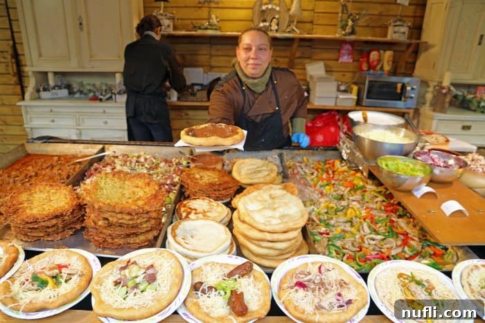 Shopkeeper handing out Nutella covered pita