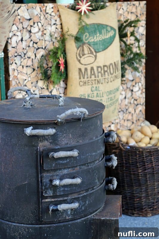 Chestnut roasting on an open fire next to a bag of chestnuts at a market stall