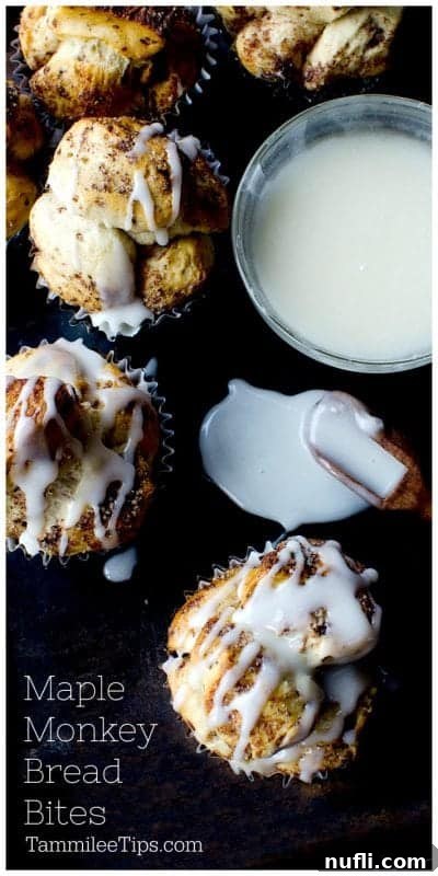 Overhead shot of Maple Cinnamon Roll Monkey Bread Bites, freshly baked and glazed, arranged on a rustic dark board. An easy sweet muffin the family will love.