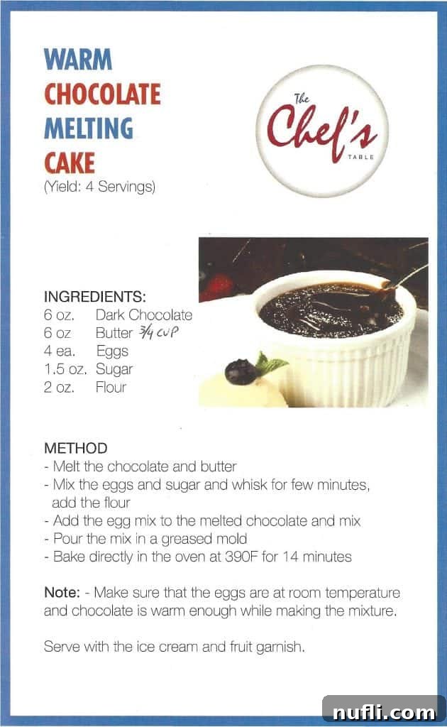 A stunning shot of a Carnival Cruises Warm Chocolate Melting Cake, perfectly baked and ready to be served, a testament to its home-made vacation recreation potential.