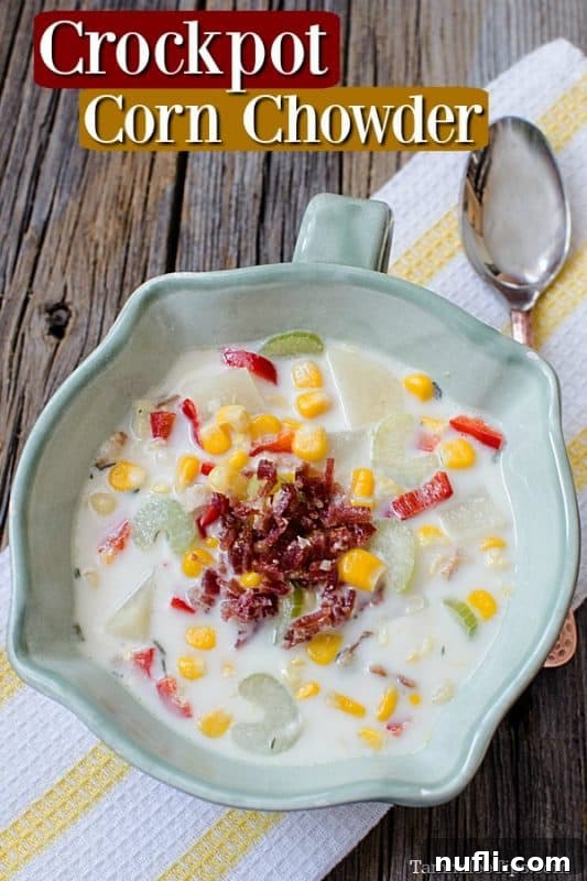A serving of creamy slow cooker bacon corn chowder in a rustic bowl with a spoon, ready to be enjoyed.