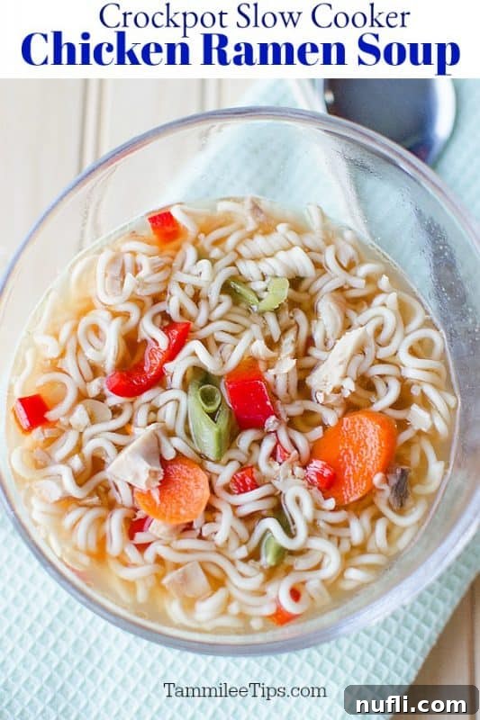 A close-up of a steaming bowl of Slow Cooker Chicken Ramen Soup, rich with chicken, vegetables, and noodles, invitingly presented in a glass bowl.
