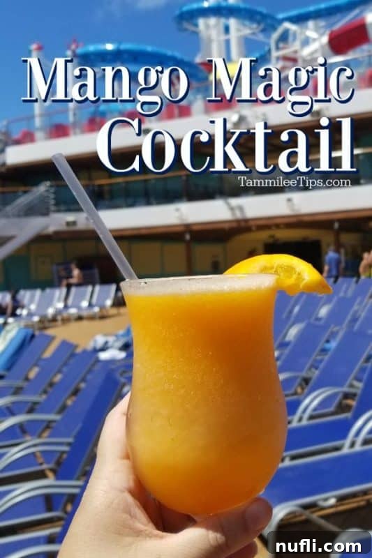 Mango Magic Cocktail in a hurricane glass, held against a blurred background, evoking a tropical cruise atmosphere.