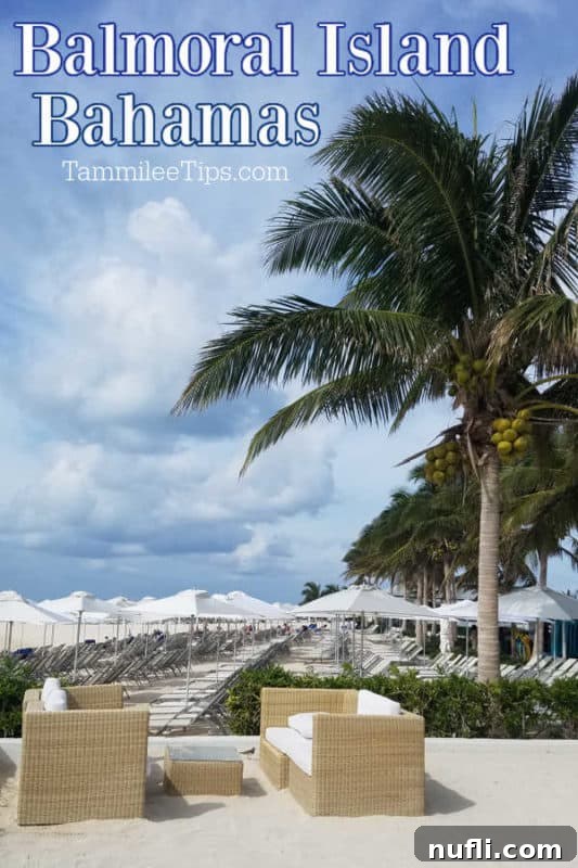 Balmoral Island Bahamas over white chairs and umbrellas with palm trees swaying gently