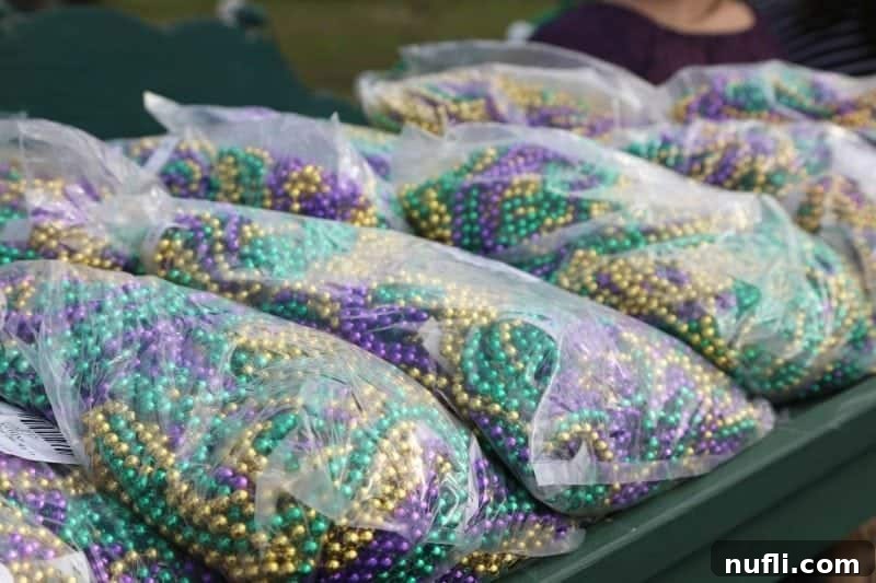Large bags filled with colorful Mardi Gras beads, ready to be distributed during the parade.