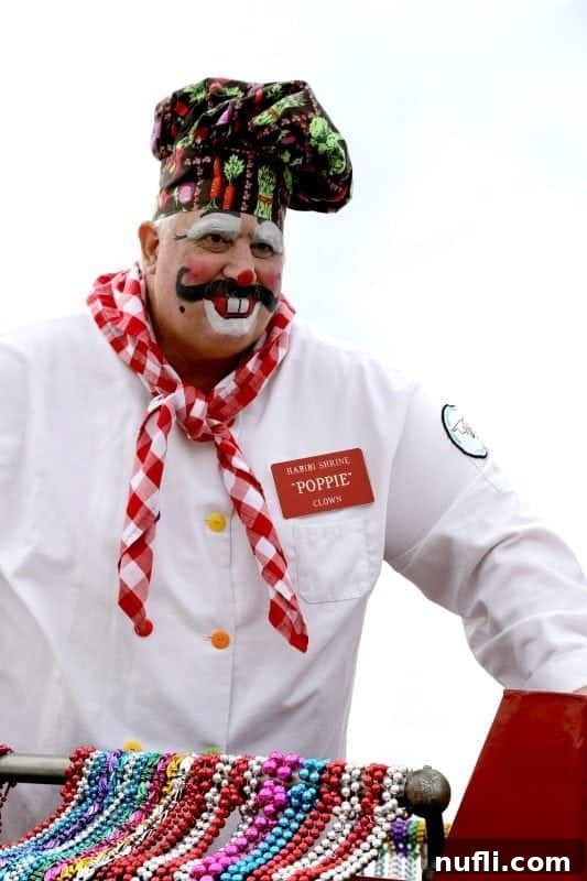 A cheerful chef with a nametag 'Poppie' and clown makeup, exuding fun at the Mardi Gras parade.