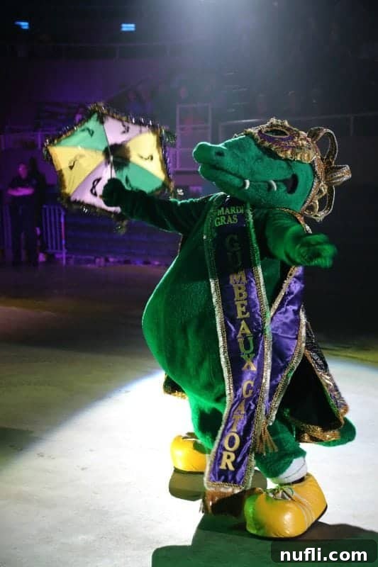 Gumbeaux Gator dressed for mardi gras