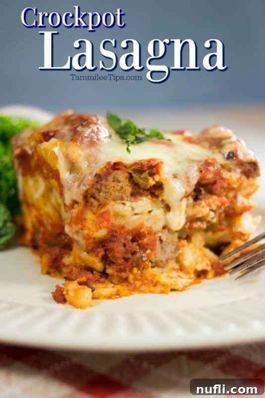 A generous serving of Crockpot Lasagna on a pristine white plate, showcasing its distinct layers of pasta, rich meat sauce, and melted cheese.