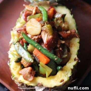 Teriyaki chicken and vegetables in a pineapple bowl
