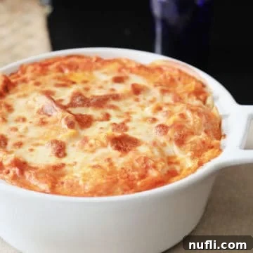 Baked ziti in a white casserole dish
