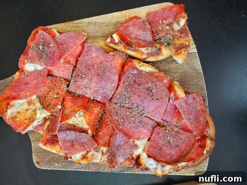Orange Beach and Gulf Shores Must Try Restaurants 18 Pepperoni flatbread pizza on a wood board