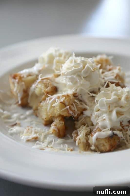 Orange Beach and Gulf Shores Must Try Restaurants 35 bread pudding with whipped cream on a white plate