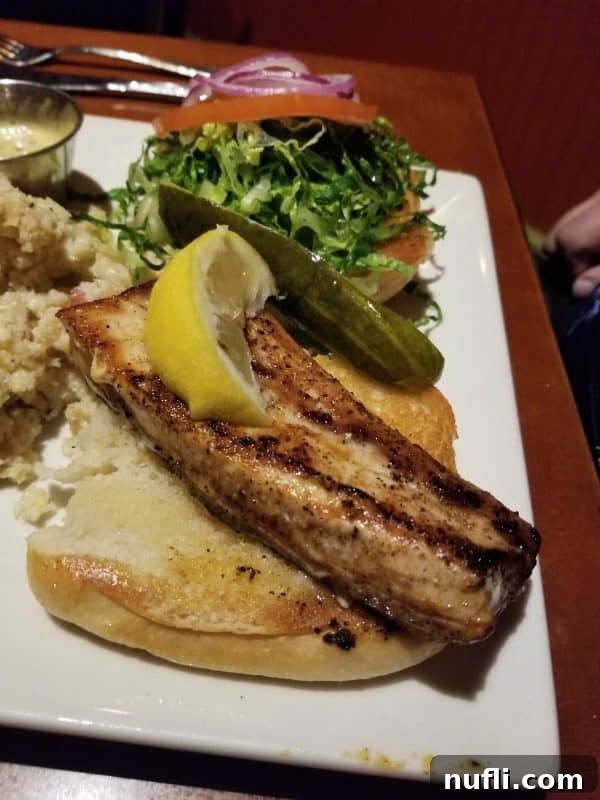 Orange Beach and Gulf Shores Must Try Restaurants 49 Fish piece on a bun with a lemon slice