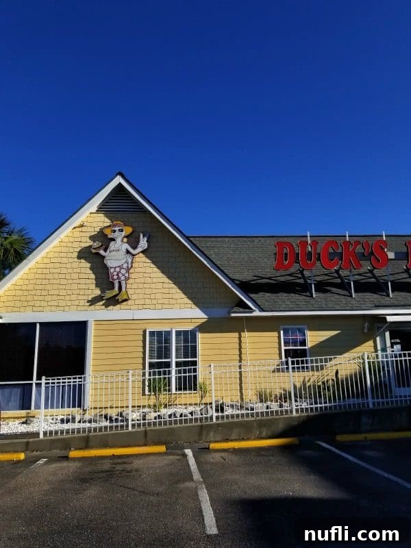 Orange Beach and Gulf Shores Must Try Restaurants 50 Duck's Diner entrance with a yellow building