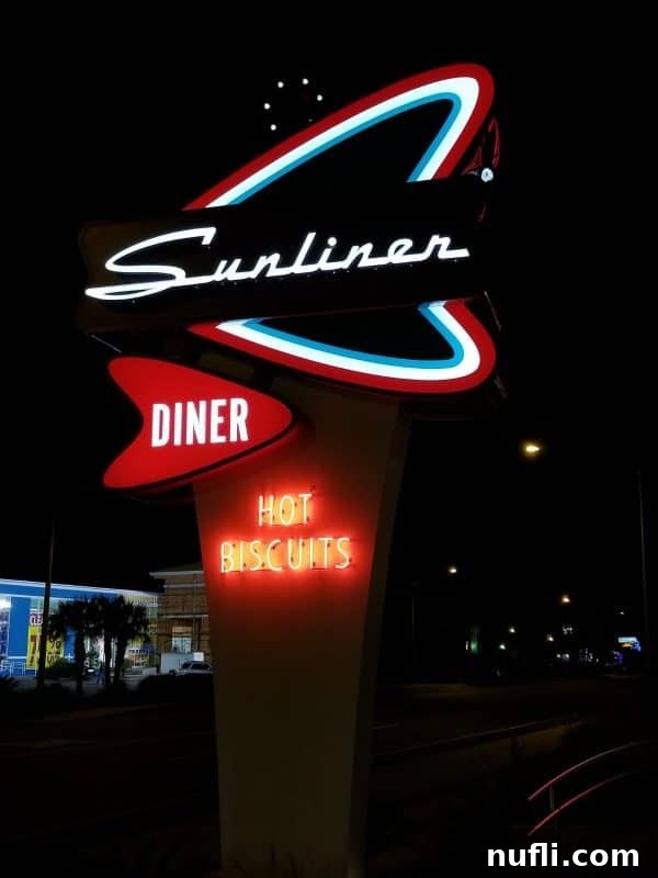 Orange Beach and Gulf Shores Must Try Restaurants 6 Sunliner Diner sign at night with hot biscuits light