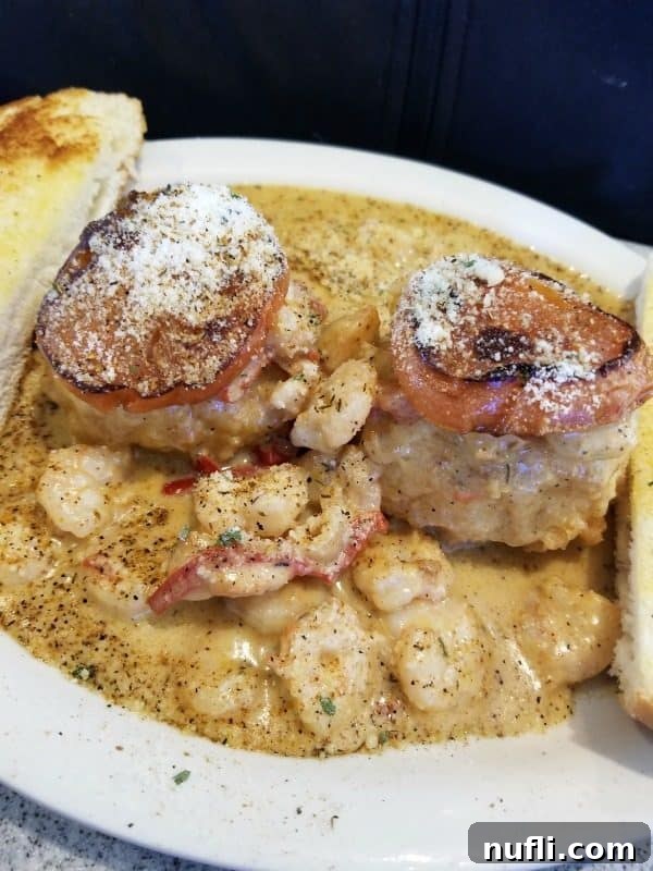 Orange Beach and Gulf Shores Must Try Restaurants 51 Creole Shrimp and grit cakes on a white plate