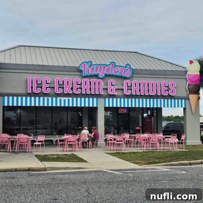 Orange Beach and Gulf Shores Must Try Restaurants 53 Kayden's Ice Cream and Candies entrance sign with pink tables and chairs