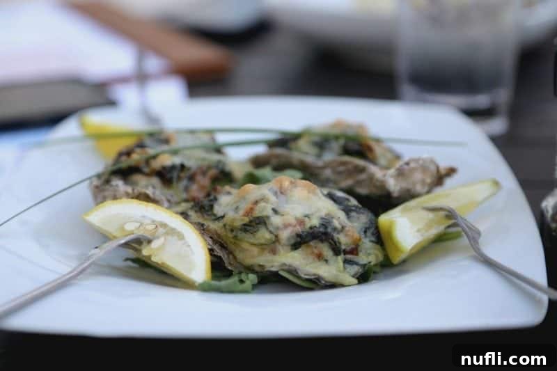 Orange Beach and Gulf Shores Must Try Restaurants 56 oysters with lemon slices on a white plate