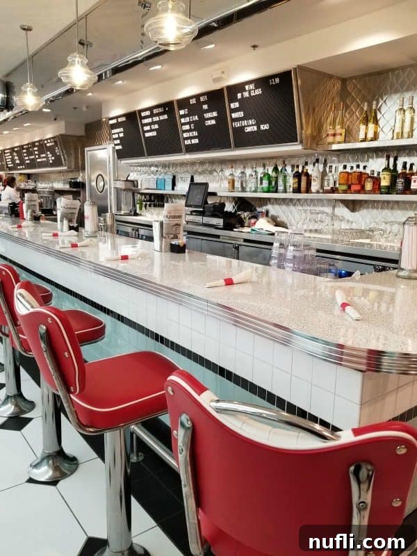 Orange Beach and Gulf Shores Must Try Restaurants 7 Sunliner Diner counter service with red chairs