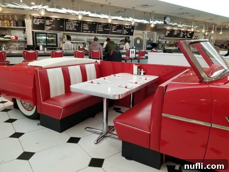 Orange Beach and Gulf Shores Must Try Restaurants 8 red classic car with table in the middle of it, counter service in the background