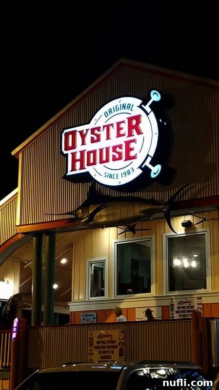 Orange Beach and Gulf Shores Must Try Restaurants 10 Original Oyster House sign lit above the restaurant