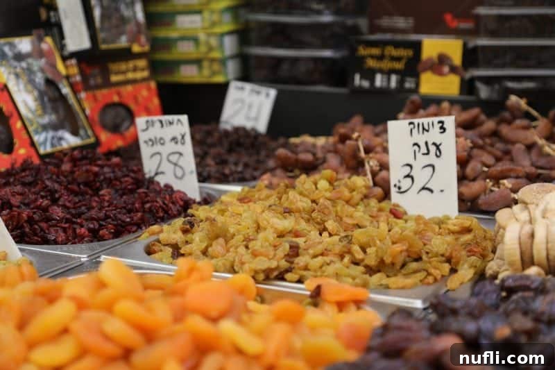 Mahane Yehuda Market Jerusalem's Culinary Soul 18 An appetizing display of colorful dried fruits, inviting shoppers to taste