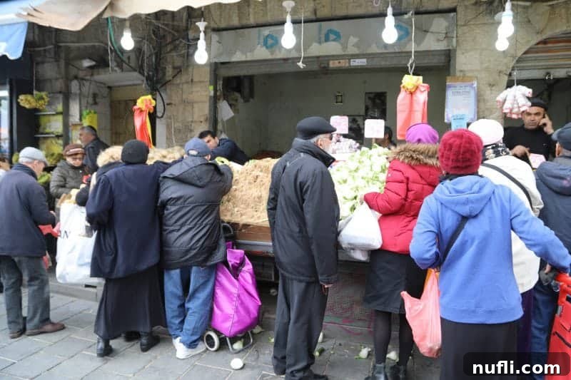 Mahane Yehuda Market Jerusalem's Culinary Soul 27 People bustling through the vibrant Mahane Yehuda Market, actively buying products
