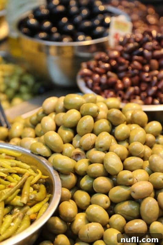 Mahane Yehuda Market Jerusalem's Culinary Soul 9 Large bowls overflowing with a variety of olives on display for sale