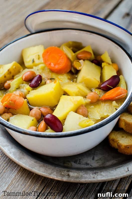 Effortless Vegetarian Slow Cooker Soup 3 vegetable soup in a white bowl on a silver tray