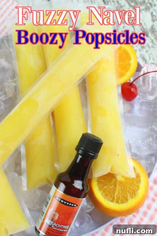 Fuzzy Navel Cocktail Freezer Pops 2 Fuzzy navel boozy popsicles over a bowl of ice with ice pops and a bottle of peachtree